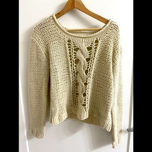 White sweater with macrame-style detailing